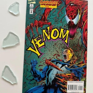 May include: A comic book cover featuring Venom and Carnage. The cover is green, red, and blue with the title "Venom" in large yellow letters. The text "Carnage Unleashed Part One of Four" is in white letters on a red background. The issue number "1" is in a white circle on a red background.
