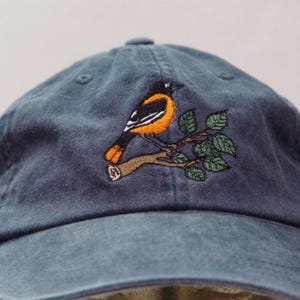Gorra bordada de los Baltimore Orioles Bird para hombre y mujer, ideal como regalo para mamá y papá. Precio: 24 colores disponibles.