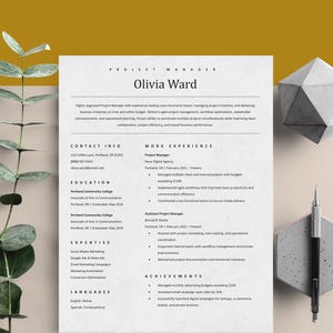 May include: A minimalist resume titled "Olivia Ward" with black text on a white background. The resume includes sections for contact info, work experience, and education. A geometric shape and a pen are on the right side.
