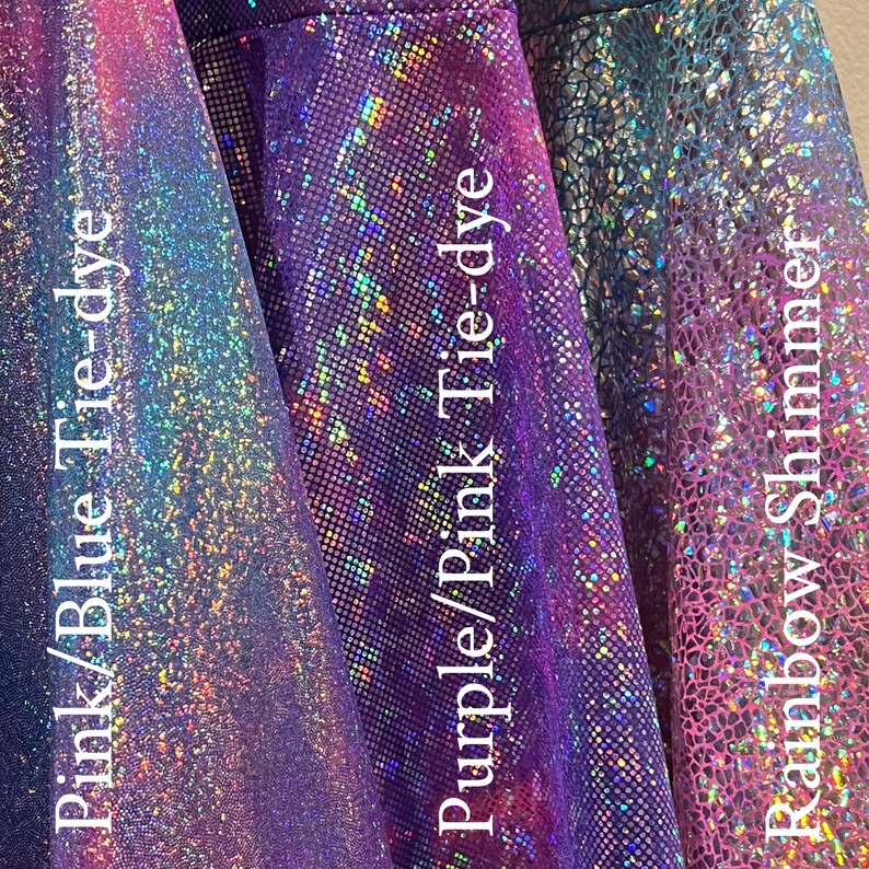 May include: Three swatches of iridescent fabric in pink/blue tie-dye, purple/pink tie-dye, and rainbow shimmer.