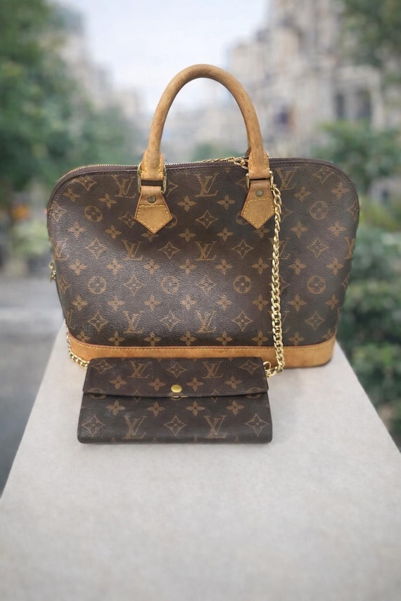Louis Vuitton Monogram Alma PM Monogram Handbag. M53151 LV Brown +