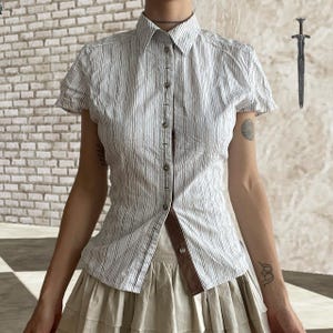 White and Brown Pinstripe Fitted Blouse featuring button down high neck and ruched details on sleeves