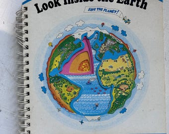 May include: A spiral-bound children's book titled "Look Inside the Earth" with a colorful illustration of the Earth's layers. The cover includes the text "Save the Planet!" and a pull-out tab with icons. A "Poke & Look Learning Book".