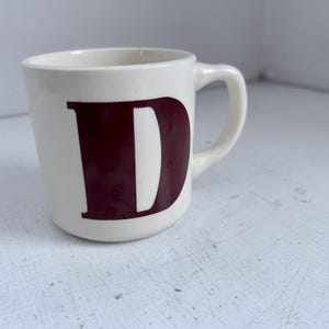 May include: A set of three ceramic nesting bowls in shades of blue, green, and white. The bowls feature a speckled glaze and a simple, modern design. The largest bowl is approximately 7 inches in diameter.