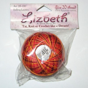 May include: A ball of Lizbeth size 20 thread in a clear plastic package. The thread is a mix of red, orange, and yellow. The packaging includes the text "Falling Leaves" and "100% Egyptian cotton". The label reads "Tat, Knit or Crochet like a Dream!"