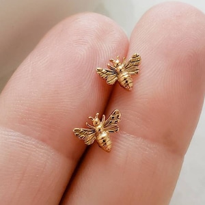 Tiny gold top bee earrings