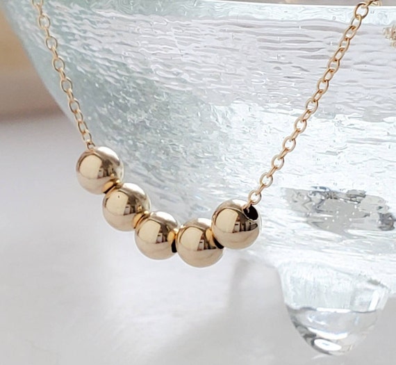 Floating bead necklace deals