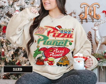 Retro Pizza Planet Toy Story Christmas Sweatshirt, Aliens Toy Story Pizza Planet Xmas Tee, Mickeys Very Merry Christmas Disneyland 2025 Trip