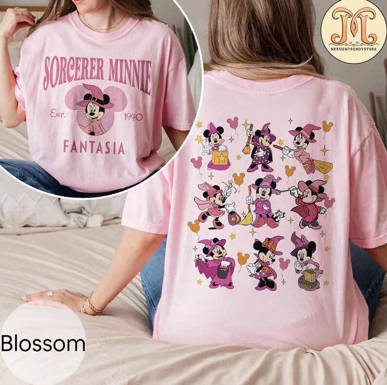 May include: Pink t-shirt with the text "SORCERER MINNIE Est. 1940 FANTASIA" on the front and a design of nine Minnie Mouse characters dressed as witches on the back.
