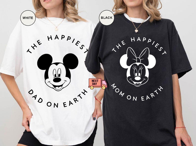 May include: White and black t-shirts with Mickey and Minnie Mouse designs. The white shirt says "The Happiest Dad on Earth" and the black shirt says "The Happiest Mom on Earth". Both shirts have a circular design.