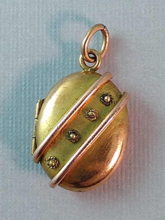 Etruscan revival rolled gold oval locket