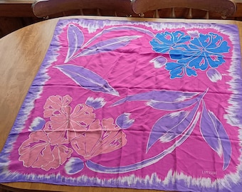May include: A pink silk scarf with a floral design featuring purple, blue, and pink flowers. The scarf has a white border and the text "LIMSSINK" in the bottom right corner.