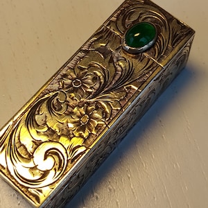 Sterling silver lipstick case engraved with stone