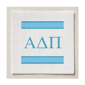 May include: A square white needlepoint canvas featuring a grid texture. The design includes two horizontal light blue stripes, one above and one below the Greek letters Alpha, Delta, and Pi, which are printed in a matching light blue colour.