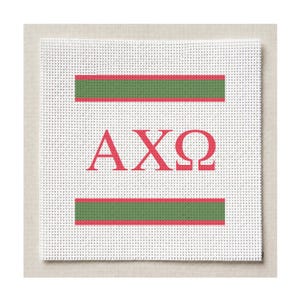 May include: A square white needlepoint canvas featuring a centred red Greek letter design reading AXΩ. The design is flanked by two horizontal stripes, each consisting of a central green band bordered by thin red lines above and below.