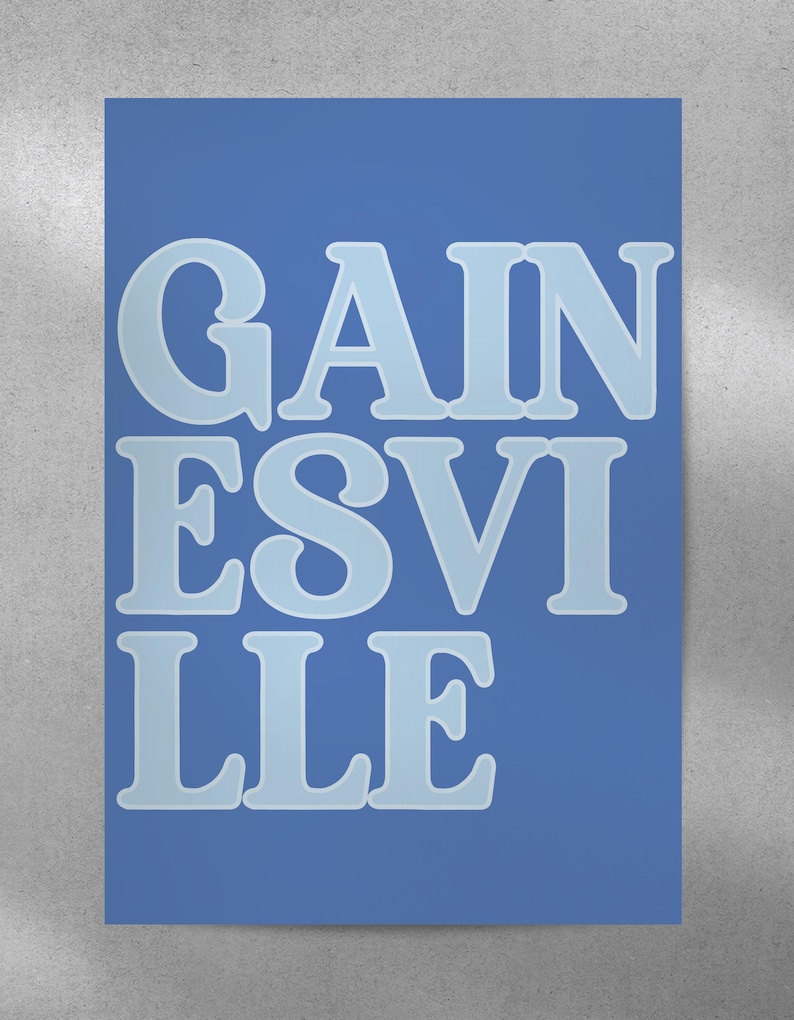 May include: A blue poster with the text "GAIN ESVILLE" in white letters.