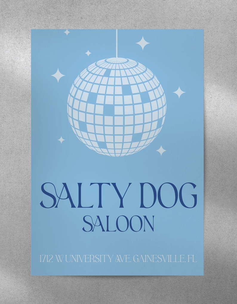May include: A blue poster with a white disco ball and the text "Salty Dog Saloon" in navy blue. The address "1712 W University Ave. Gainesville, FL" is printed in navy blue at the bottom.