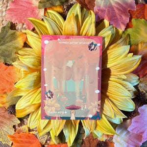 May include: An illustrated card in red and yellow featuring a forest scene, mushrooms, and bees. The card includes the text "Yahweh Artist Studios" and "Isaiah 40:8".