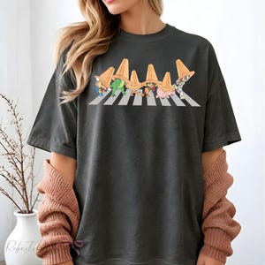 May include: A distressed wooden sign with the words "Welcome to our home" in white lettering. The sign has a rustic finish, ideal for adding a welcoming touch to any home's entrance.