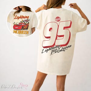 May include: A handmade wooden sign with the text "Welcome" in a whimsical font. The sign is painted white with a distressed finish, and features a decorative floral design in shades of pink and green. It measures approximately 12 inches wide and 6 inches tall.