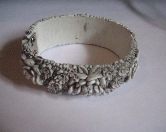 Hinged Clamper Style Black and White Celluloid Deeply Carved Roses Bracelet from the 50s