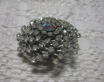 JUDY LEE Signed Pin Wheel or Spiral Rhinestone pin in Silver Tone with Rose AB Center