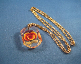 Back Carved Red and Yellow Roses in Octagon Lucite Pendant on Gold Tone 24 inch Chain from the 40s