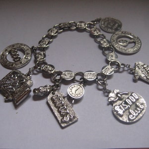 Sarah Coventry Dealers Vintage Charm Bracelet in Silver Tone Metal