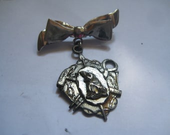 Sterling Bow with Religious Medal Dangle