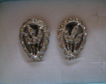 POLCINI Floral Center Rhodium Plated Clip On Earrings with Rhinestone Accents