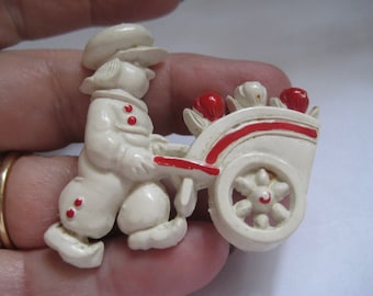 Cute Dutch Boy Pushing a Cart of Tulips in Early Plastic