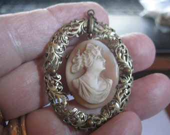 Victorian Carved Shell Right Facing Cameo in a Gold Oval Shaped Filigree Setting Cameo Swings in Setting