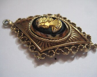 Unusual Art Deco style Black and Gold Cameo Pendant in Diamond Shape Filigree Edges