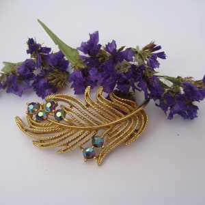 LISNER plume plaqué or broche avec strass améthyste AB