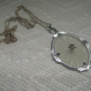 Art Deco  Rhodium Plated Filigree Necklace with Camphor Glass in Starburst Design with Rhinestone in Star