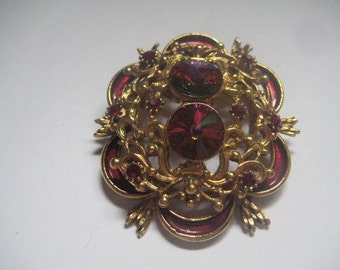Volcano Rivolis in Goldtone Multi-layered Scroll Work Designed Brooch with Enamel Ribbon