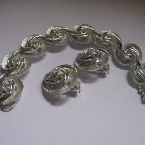 Demi Parure of Bracelet and Clipback Earrings in Rhodium Plated Feathers Mint Condition