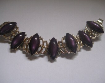 Gold Tone Panel Bracelet with Purple Poured Plastic Cabochons