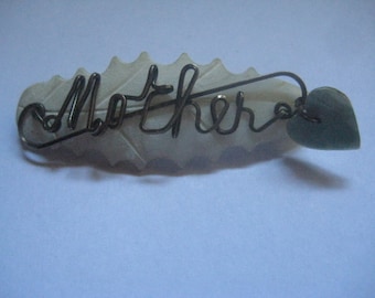 Mother on Mother of Pearl Sweetheart Leaf ShapedBrooch from the 40s  with Heart Dangle Aslo in MOP So Lovely