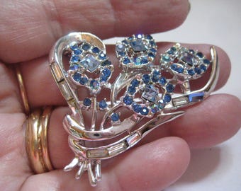 Unmarked Beauty Rhinestone Pin with Light Sapphire Sapphire and Crystal Stones in Floral Design
