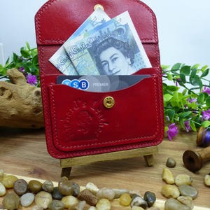 Hand made red leather card holder with fastenable centre pocket with space for 2 cards,all hand finished and stitched with Italian thread