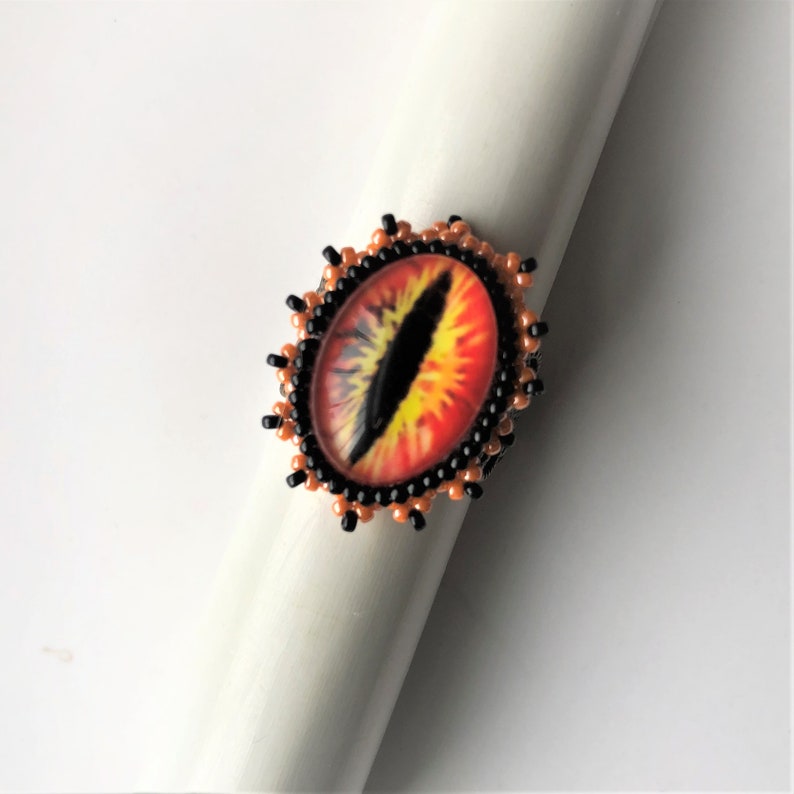 Deliver us from evil by enchantedbeas Sauron Eye Filigree Beadwoven Ring Orange Black Statement Eye of Sauron Ring Gold Plated Ring Base