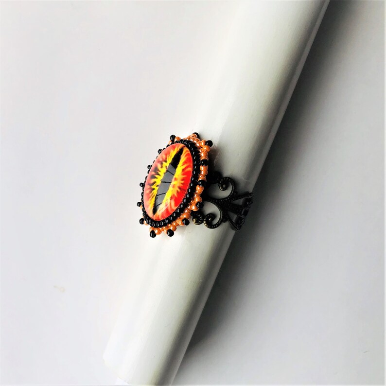 Deliver us from evil by enchantedbeas Sauron Eye Filigree Beadwoven Ring Orange Black Statement Eye of Sauron Ring Gold Plated Ring Base