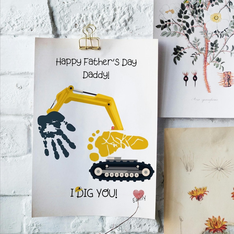 May include: A white Father's Day card with the text "Happy Father's Day Daddy!" and a yellow excavator design made from a handprint and footprint. The card also says "I DIG YOU!" and has a heart with a name.