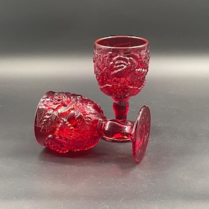 Pair of ruby red pressed glass goblets with embossed roses Bohemian vintage mid century collectible glassware