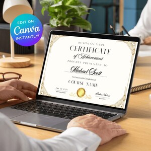 May include: A gold and black certificate of achievement with a gold seal. The certificate is on a laptop screen and reads "BUSINESS NAME CERTIFICATE of Achievement PROUDLY PRESENTED TO Michael Scott For Successful Completion of COURSE NAME Jan 12 2024 DATE SIGNED Arden Valur MENTOR".