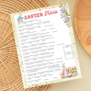 May include: A printable Easter trivia game with questions about the holiday's history, traditions, and symbols. The game features a cute illustration of a bunny rabbit holding a basket of eggs.
