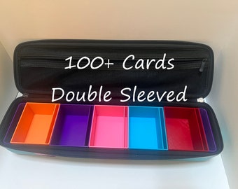 May include: Black card case with a zipper and a mesh pocket. The case is open and has five colorful compartments labeled "100+ Cards Double Sleeved".