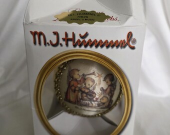 Vintage collectible M.I. Hummel silk picture glass ornament, featuring artwork typical of the Hummel style. Angel's Music, original carton.