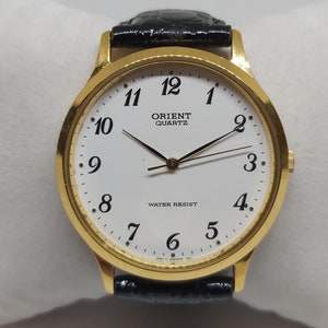 "Elegante Vintage Orient Armbanduhr - Goldfarbenes minimalistisches Design mit Original ""Seiko"" Armband."